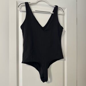 Two plunging neck and back bodysuits - pink and black